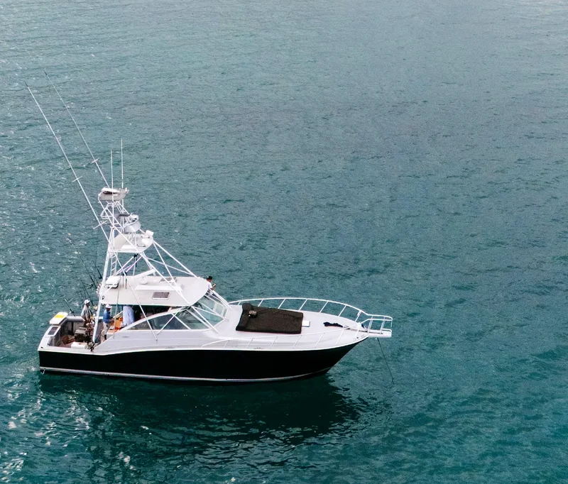 Sportfishing boat seen from above on open water Sportfishing boat seen from above on open water